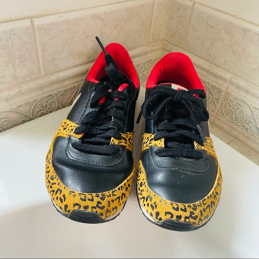 Nike size 7.5 (fits between 6.5-7.5) Safari print shoes
